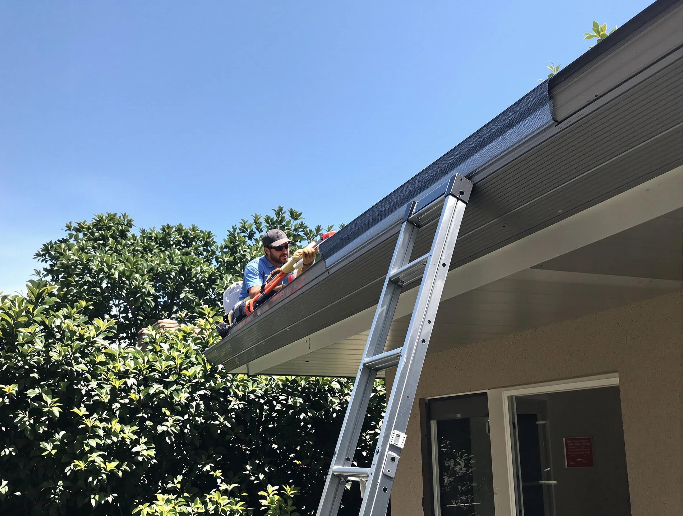 East Cleveland Roofing Company installing gutter guards for a homeowner in East Cleveland, OH