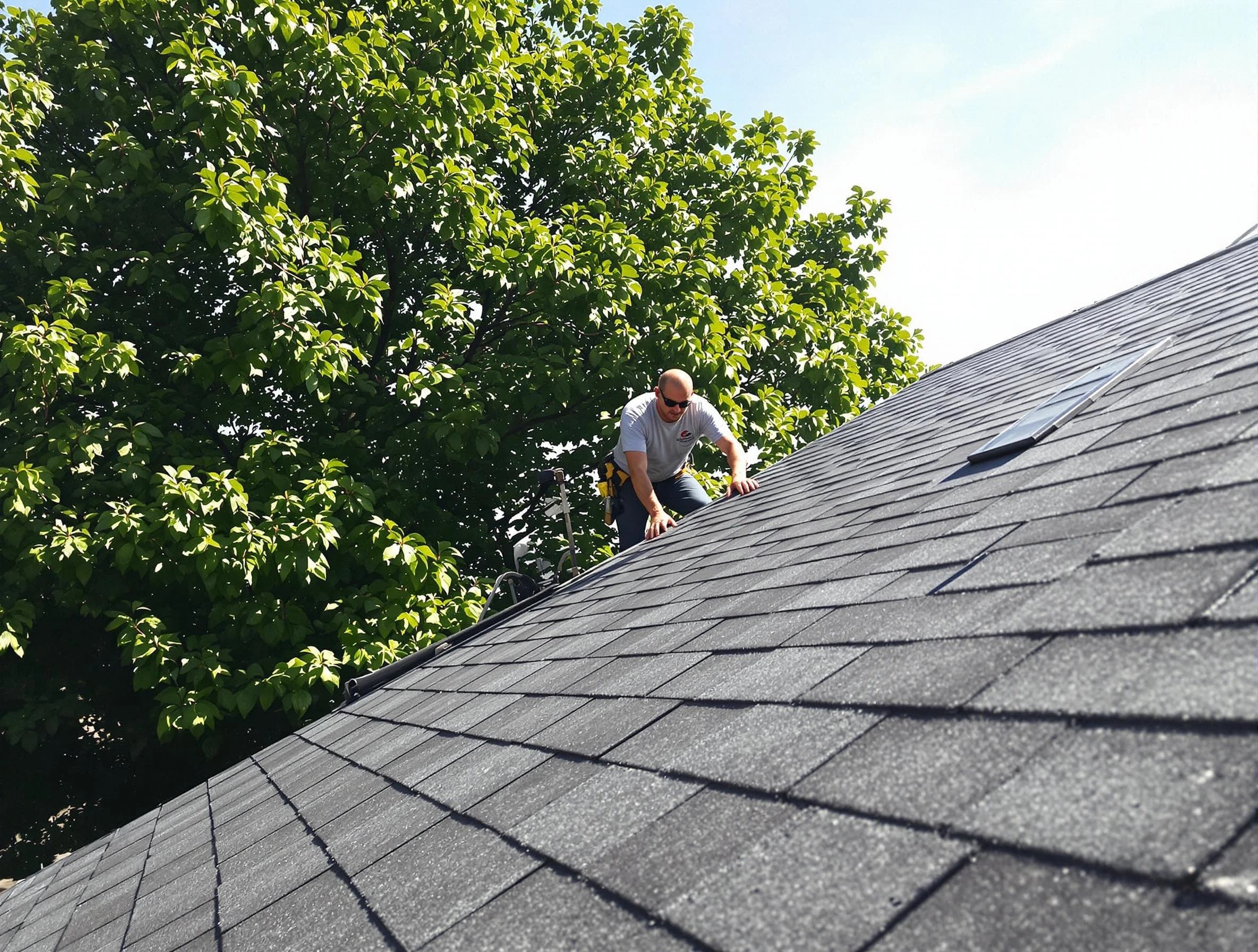 Certified roofers from East Cleveland Roofing Company working in East Cleveland, OH